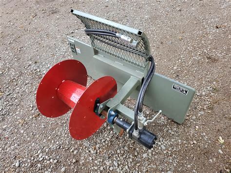 fence roller for skid steer|skid steer wire attachments.